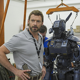 Hugh Jackman on set alongside Chappie.
