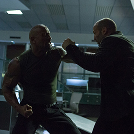 Dwayne Johnson and Jason Statham trade blows in an explosive fight scene.